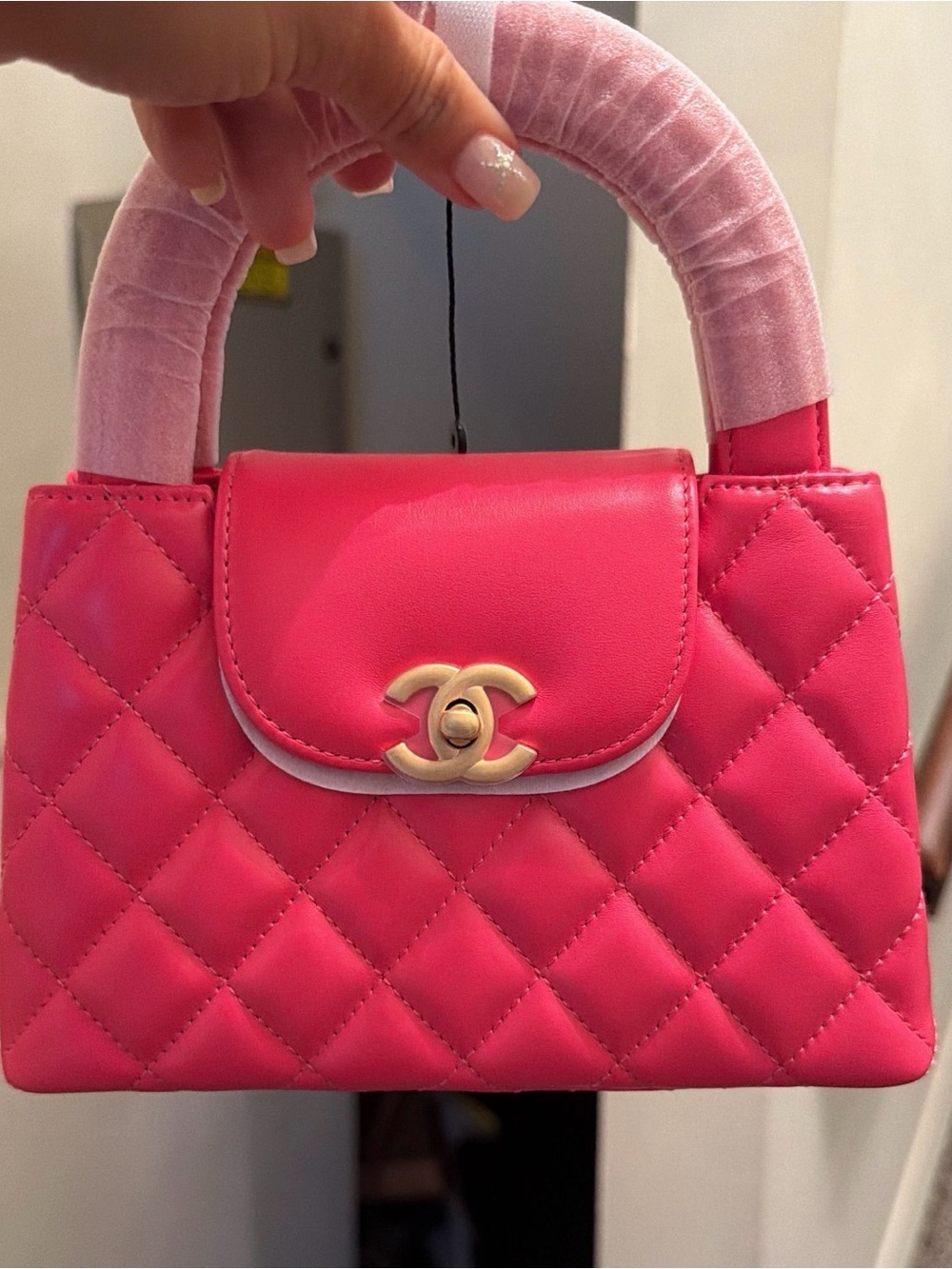 pink nano hang bag.
